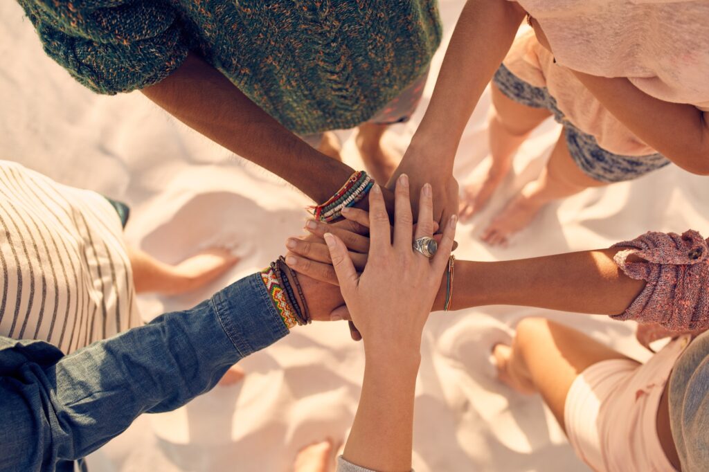 Young men and women showing unity